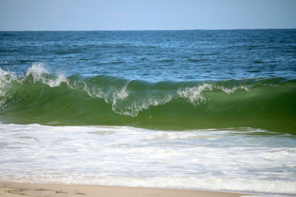 calm gap between breaking waves beach