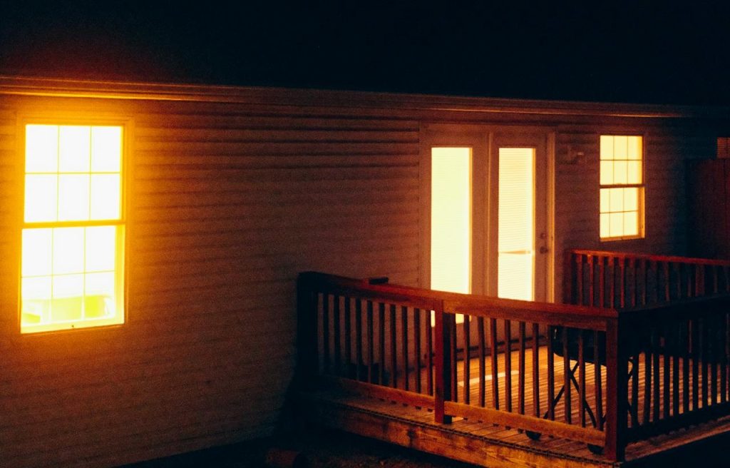lit window at night house