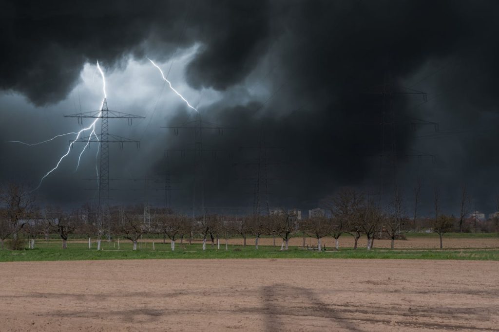 person in open field storm