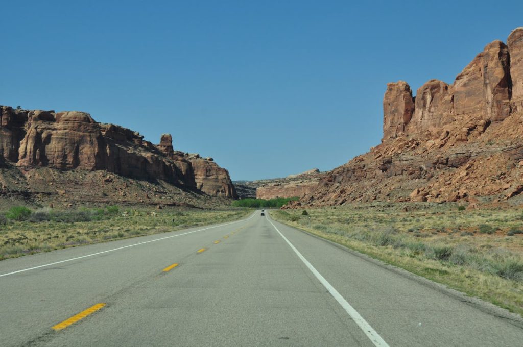 rural dirt road rock formation prairie
